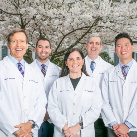 Five smiling Greenbelt dentists