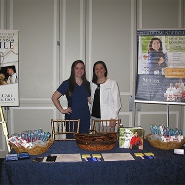 Doctor Lee and dental team member at Riggs Alumni Center Wedding Open House