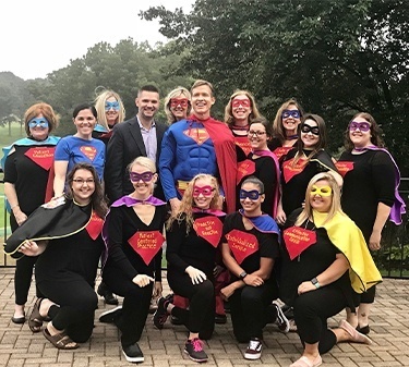 Team at super hero themed Triple Crown Study Club meeting