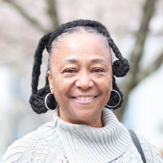 Smiling woman in gray sweater