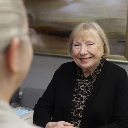 Dental team member smiling at a patient