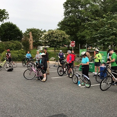 Group of bike to work week participants meeting up outdoors