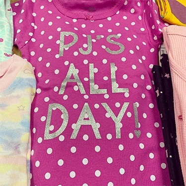 Pink pajama shirt that reads P Js all day