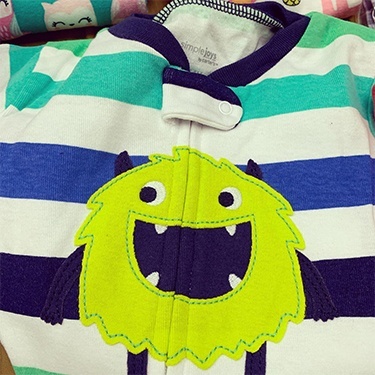 Pajama shirt with smiling fuzzy green monster