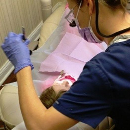 Dentist giving a child a dental exam