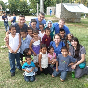 Dental team members with several children in Honduras