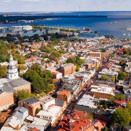 Aerial view of a city next to a body of water