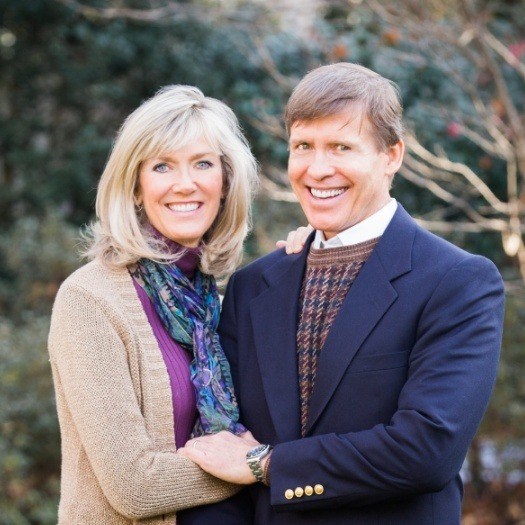 Doctor Clayton McCarl smiling with his wife Lisa