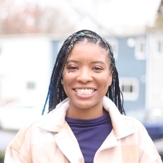 Woman grinning after cosmetic dentistry