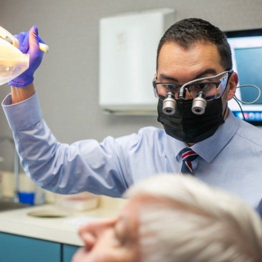 Dentist wearing dental binoculars