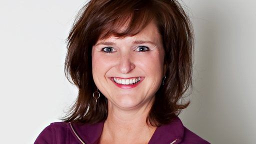Woman smiling with tooth colored fillings