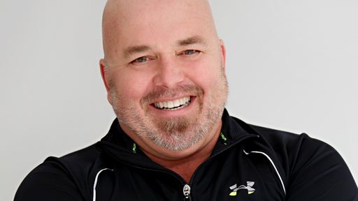 Smiling man in a black athletic shirt