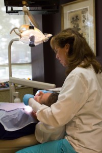 Patient recieves a thorough teeth cleaning for your Greenbelt dental hygienists at McCarl Dental Group