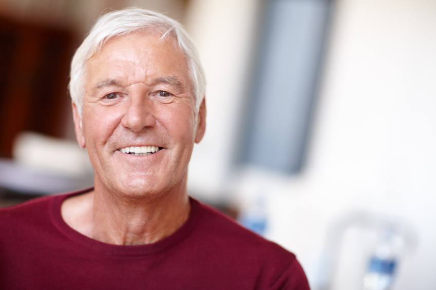 man in a red shirt with a healthy smile