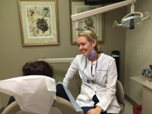 Hygienist smiling at dental patient