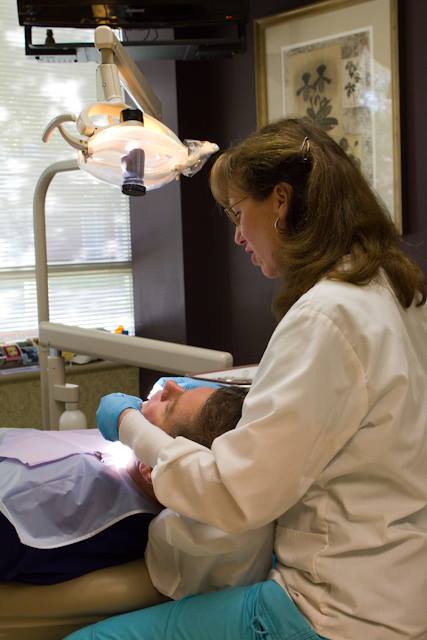 Dentist treating dental patient