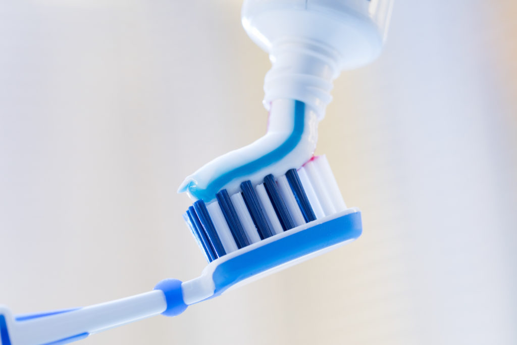 Closeup of toothpaste applied to toothbrush