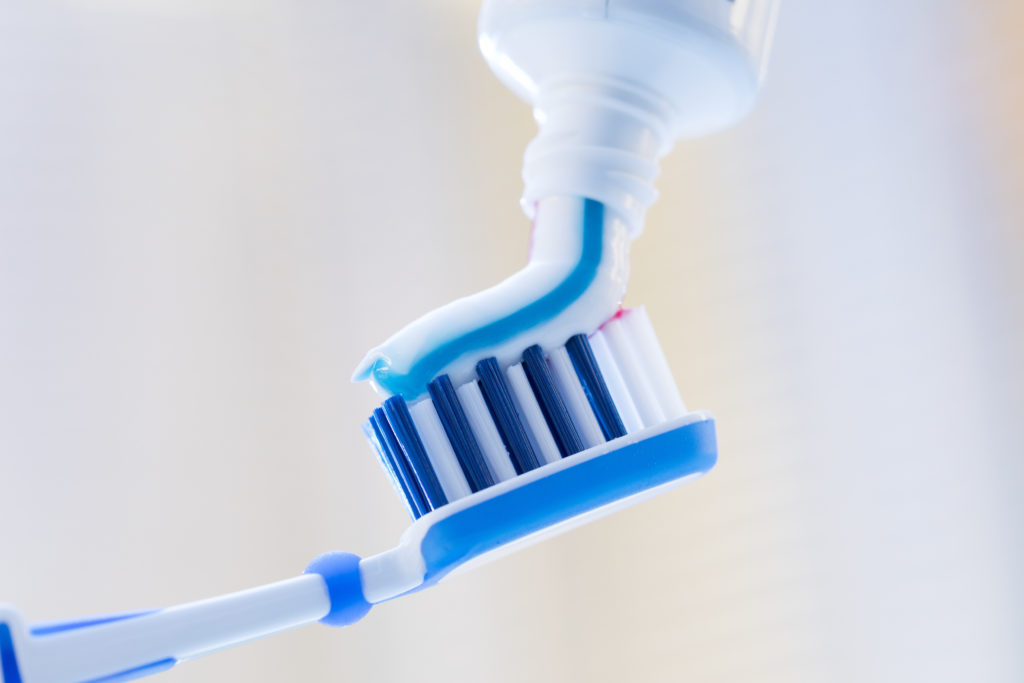 Closeup of toothpaste applied to toothbrush