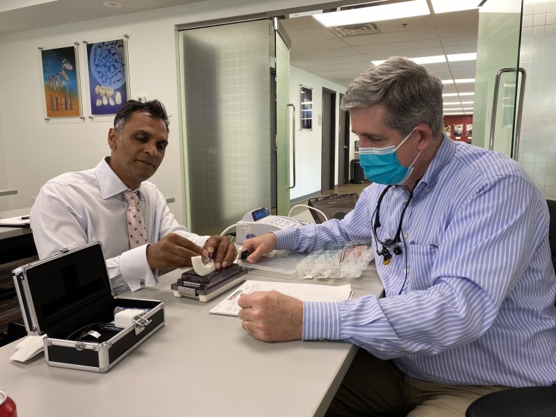 Dr. Paresh Patel and Dr. Jay McCarl at a full arch implant seminar in Louisville, KY